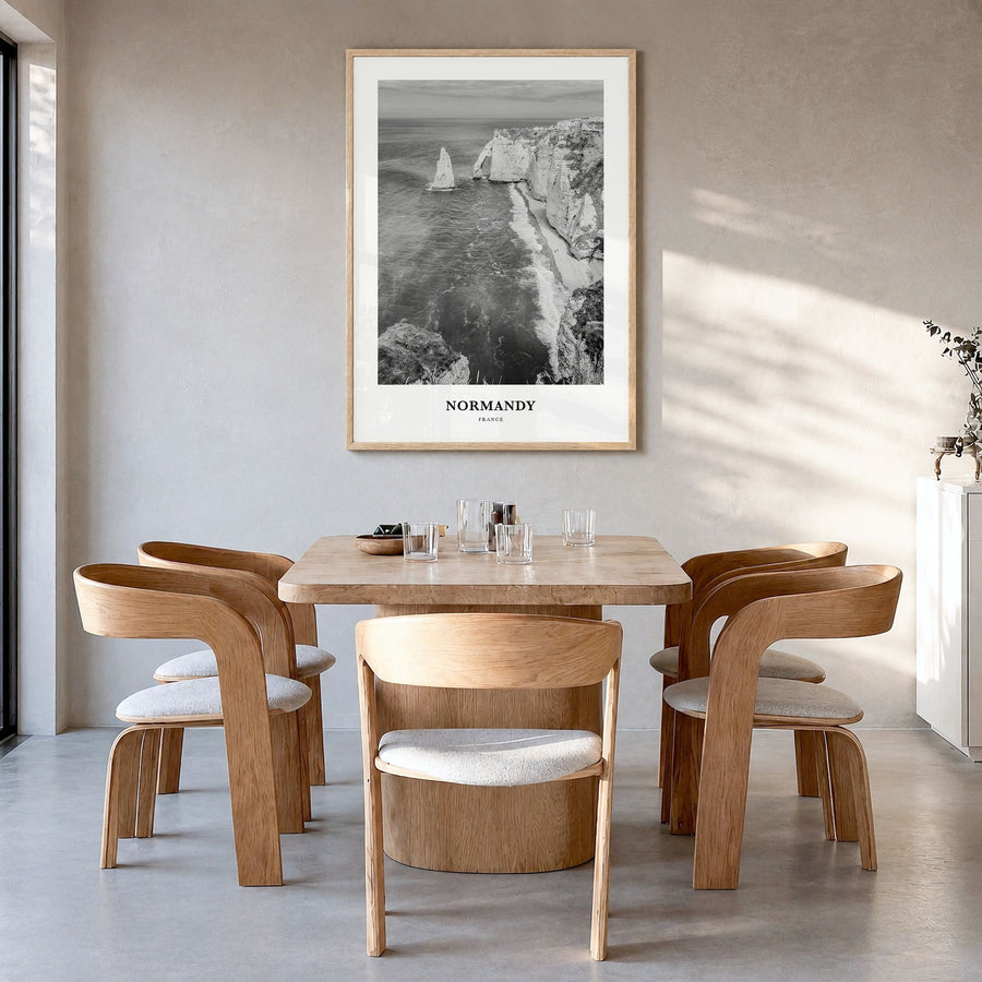 Normandy Classic Poster in a natural wood frame, hanging in a dining room