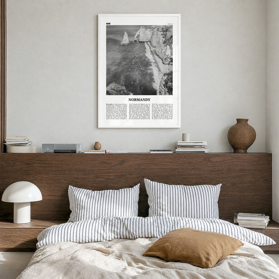 Normandy Newspaper Poster in a white wood frame, hanging in a bedroom