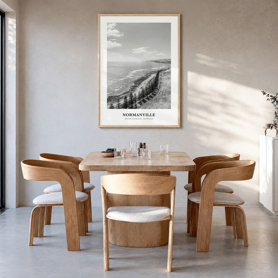 Normanville Classic Poster in a natural wood frame, hanging in a dining room