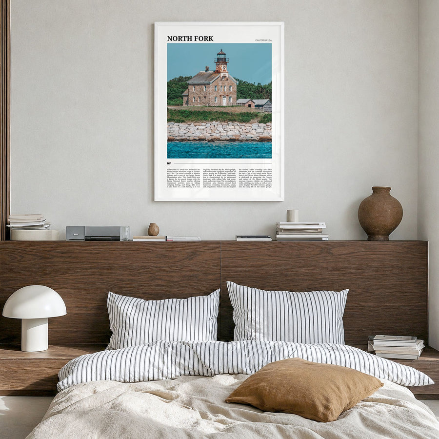 North Fork Travel Poster in a white wood frame, hanging in a bedroom