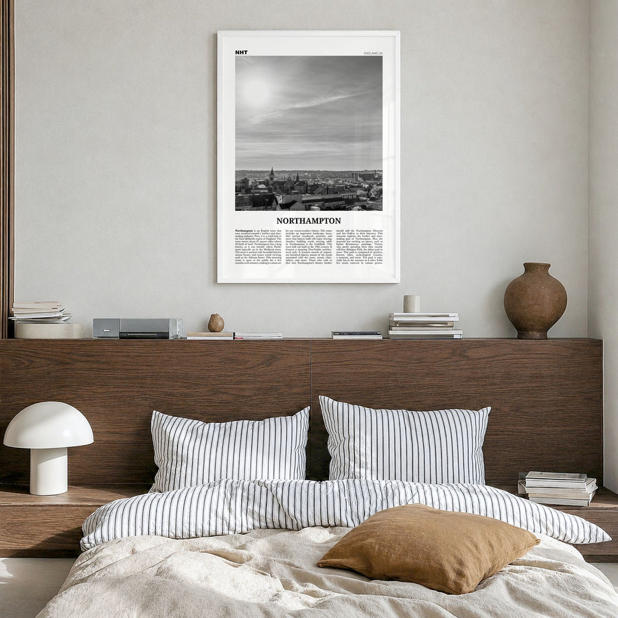 Northampton Newspaper Poster in a white wood frame, hanging in a bedroom