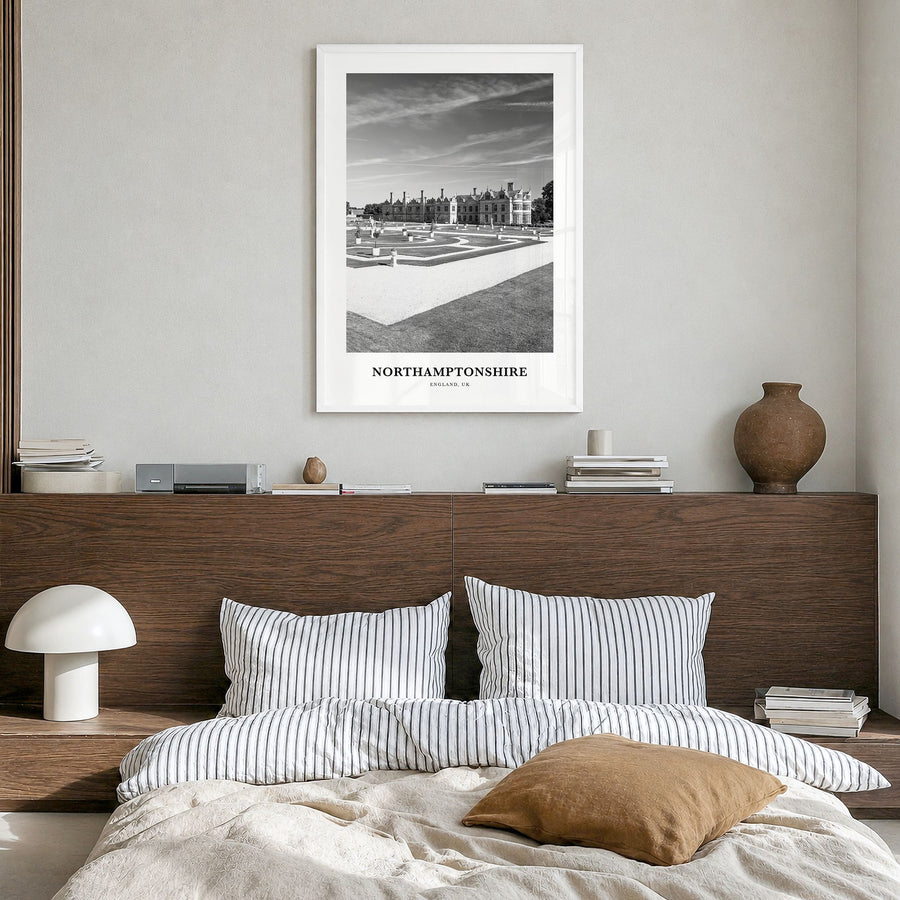 Northamptonshire Classic Poster in a white wood frame, hanging in a bedroom