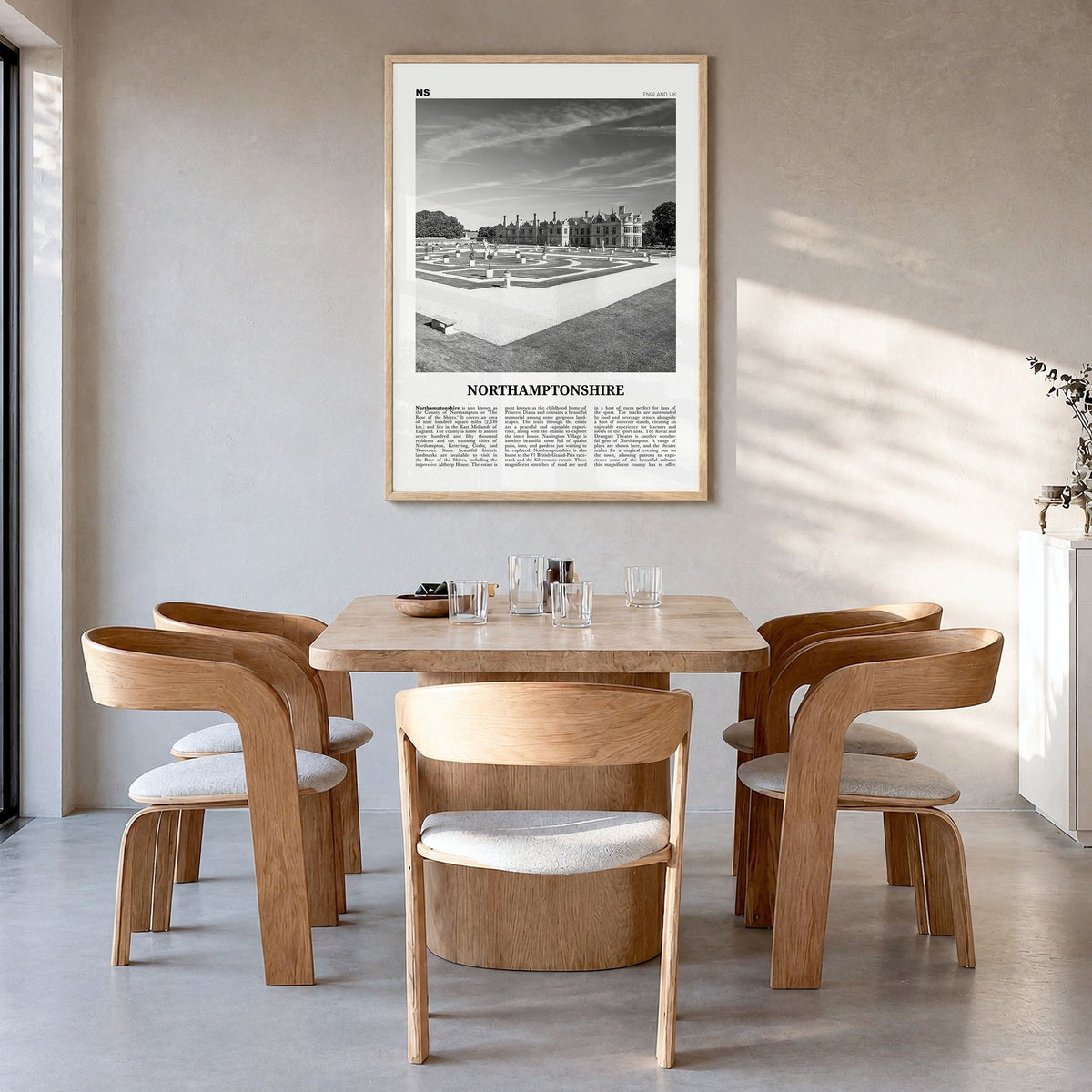 Northamptonshire Newspaper Poster in a natural wood frame, hanging in a dining room