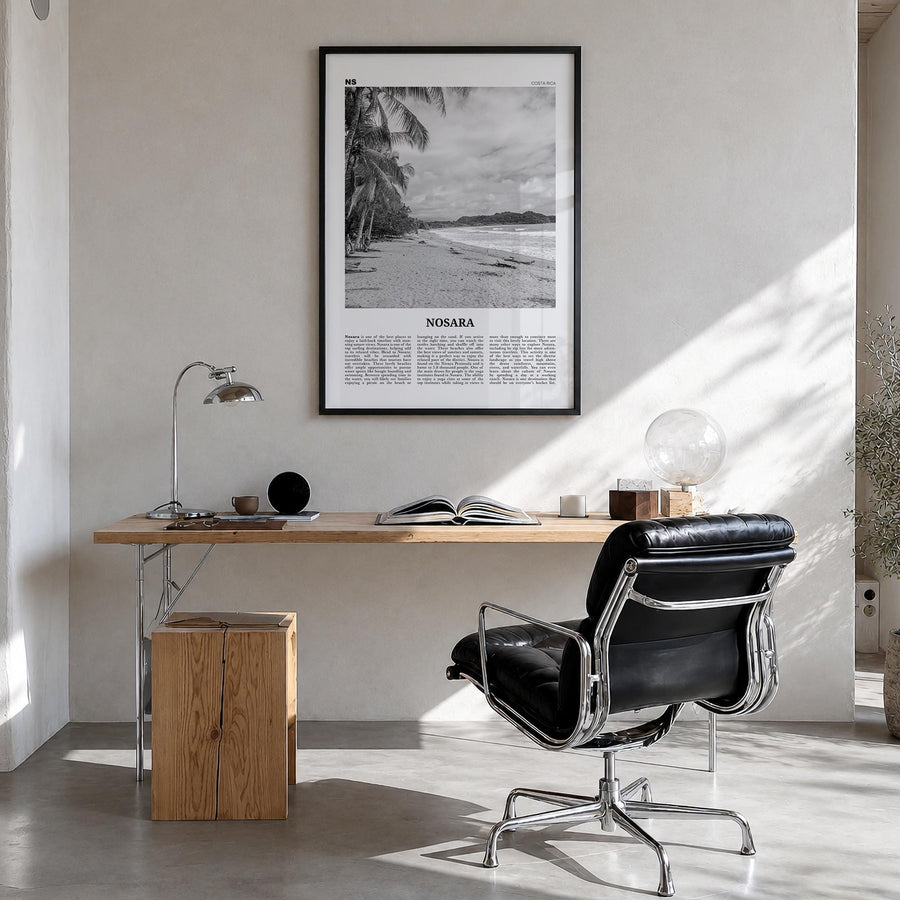 Nosara black & white newspaper poster of Costa Rica – vertical wall art in black wood frame, hanging on wall