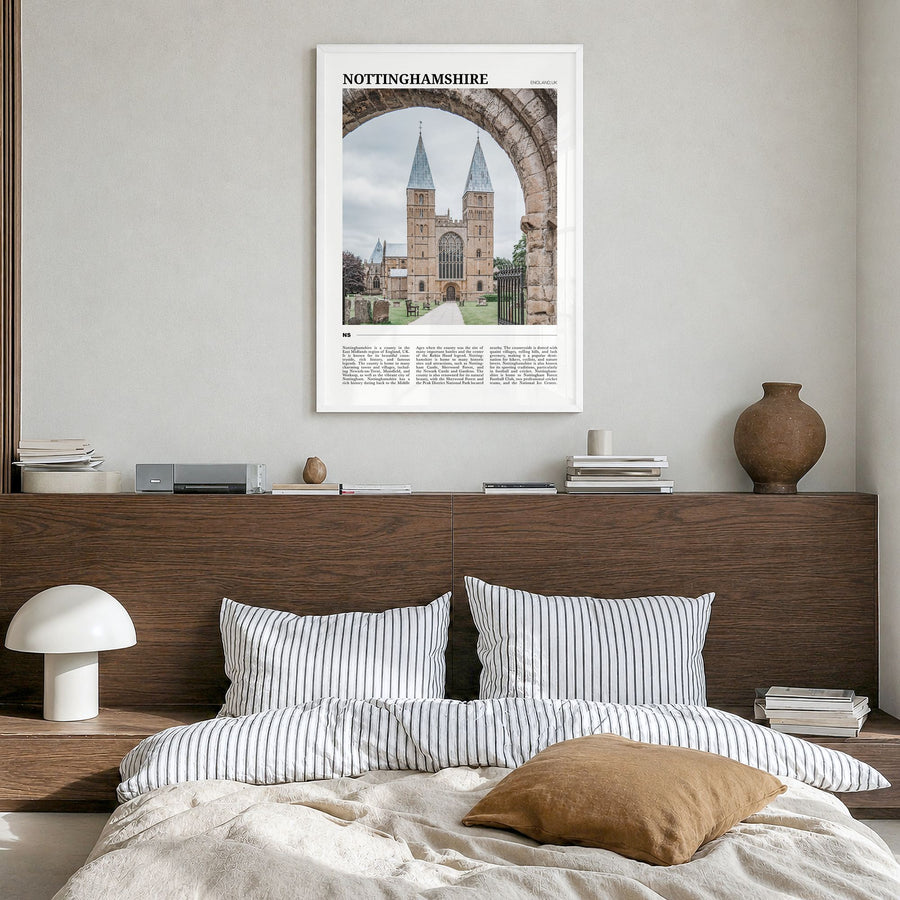 Nottinghamshire Travel Poster in a white wood frame, hanging in a bedroom