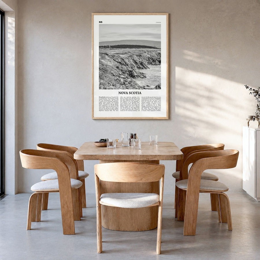 Nova Scotia Newspaper Poster in a natural wood frame, hanging in a dining room