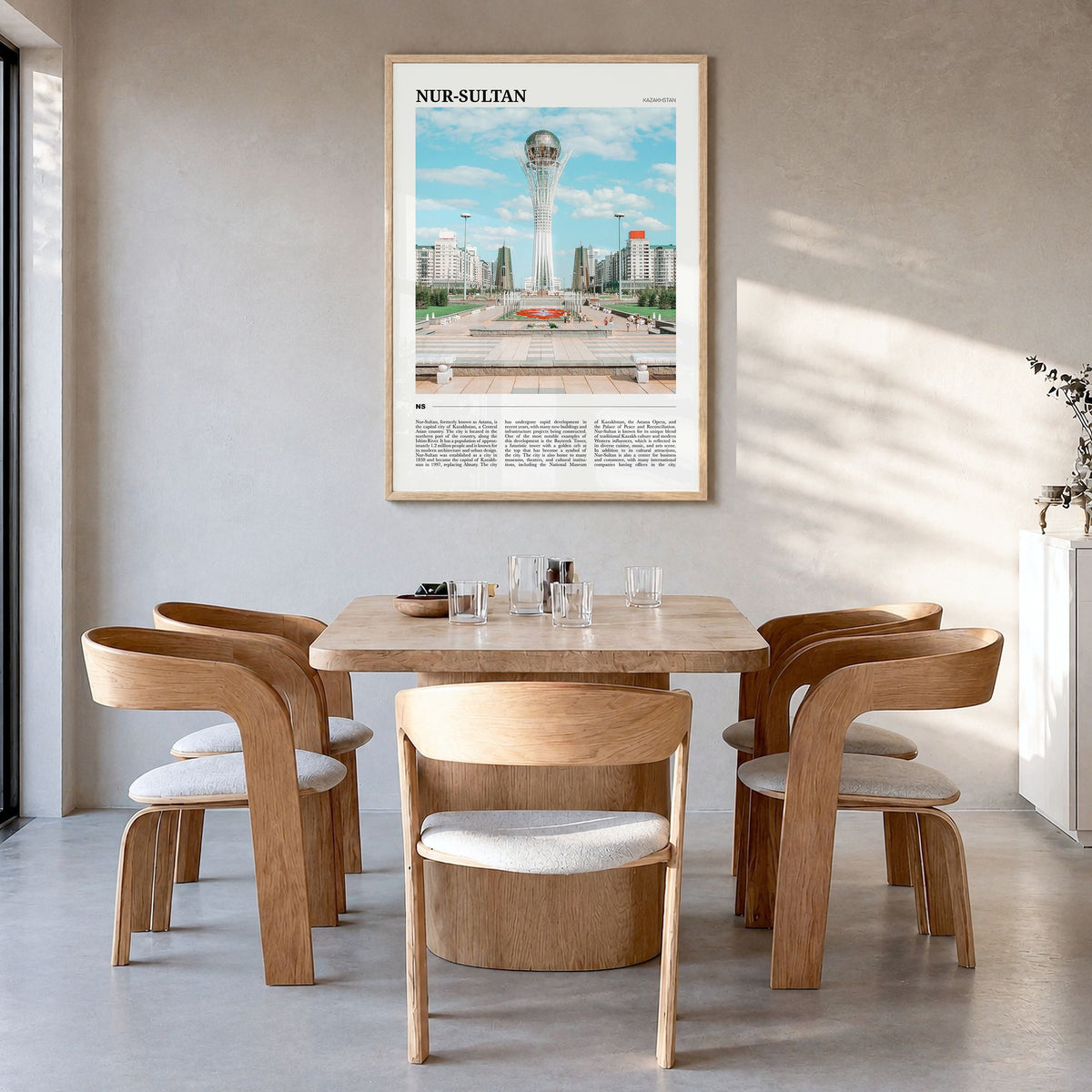 Nur-Sultan Travel Poster in a natural wood frame, hanging in a dining room