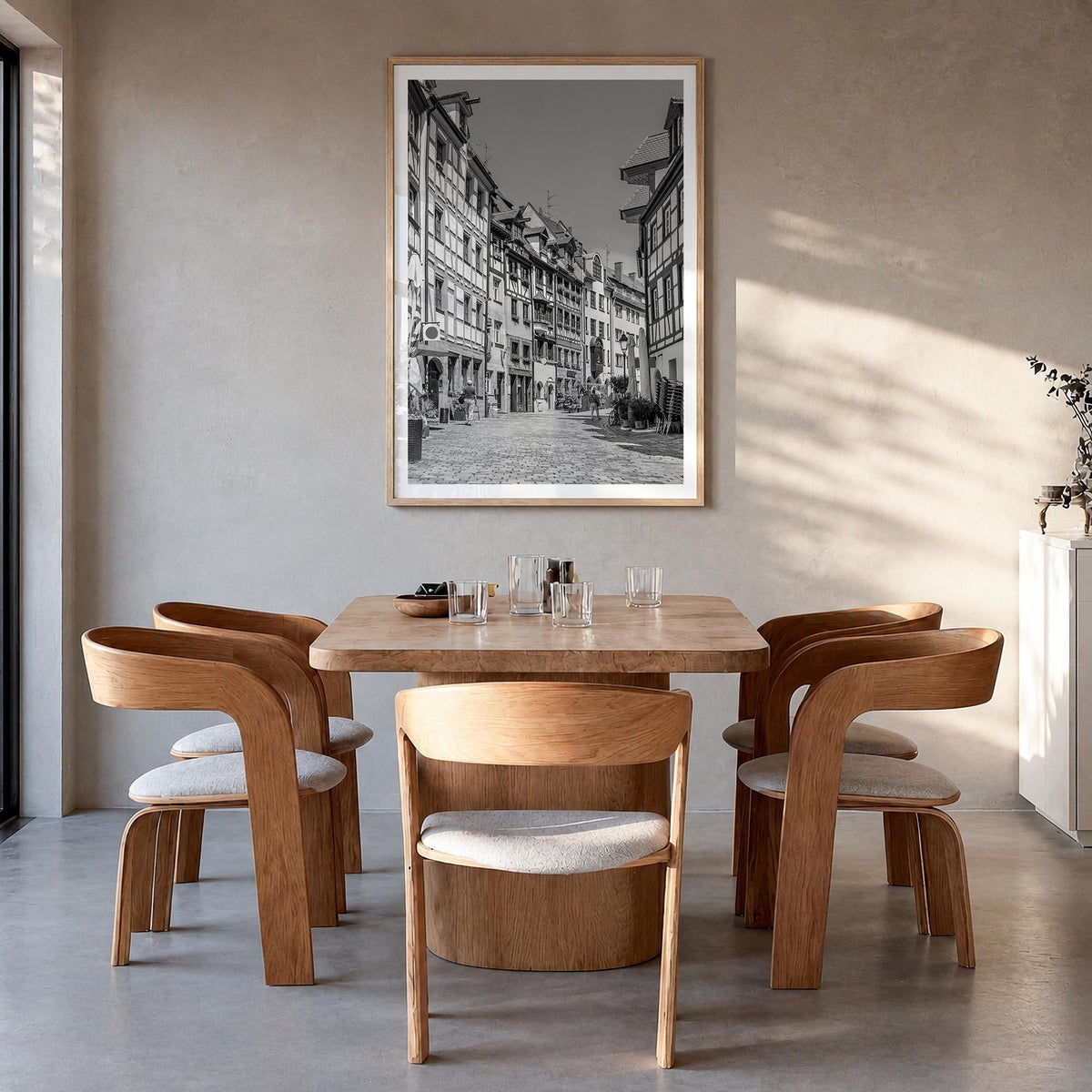 Nuremberg black & white photo poster of Germany – vertical wall art in natural wood frame with white border, hanging on wall