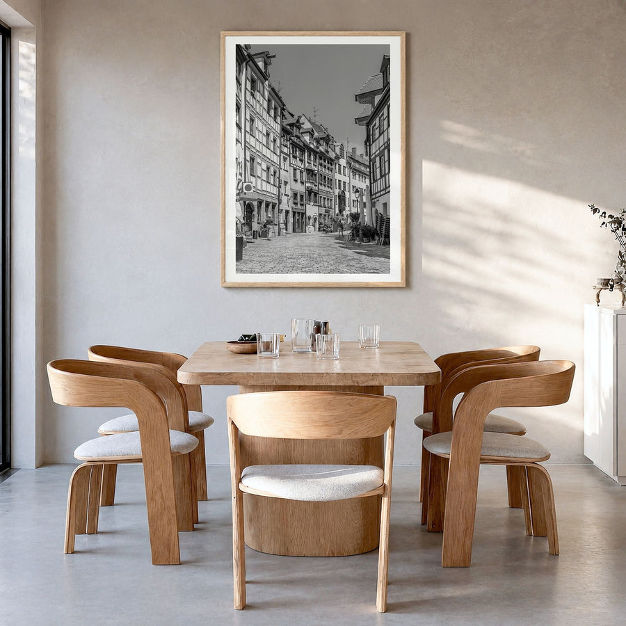 Nuremberg Photo Poster in a natural wood frame, hanging in a dining room, white border