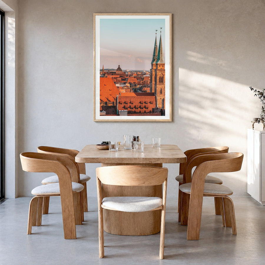 Nuremberg Photo Poster in a natural wood frame, hanging in a dining room, white border