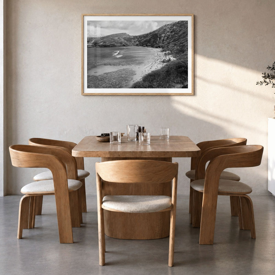 O‘ahu Photo Poster in a natural wood frame, hanging in a dining room, white border