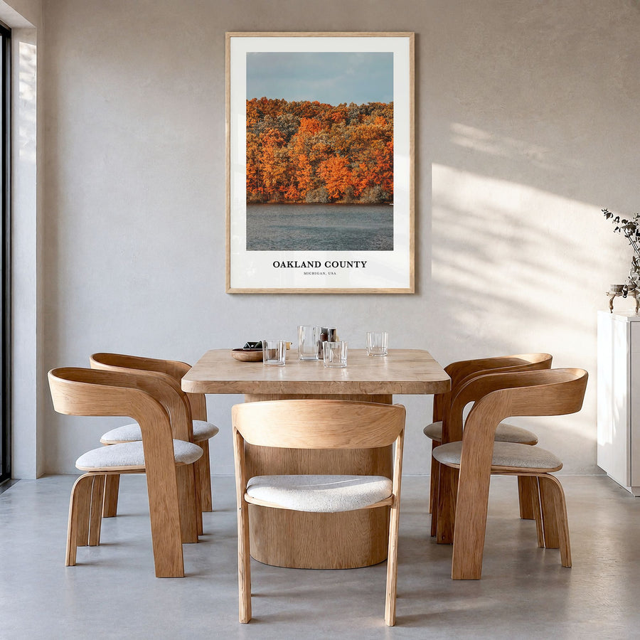 Oakland County Classic Poster in a natural wood frame, hanging in a dining room