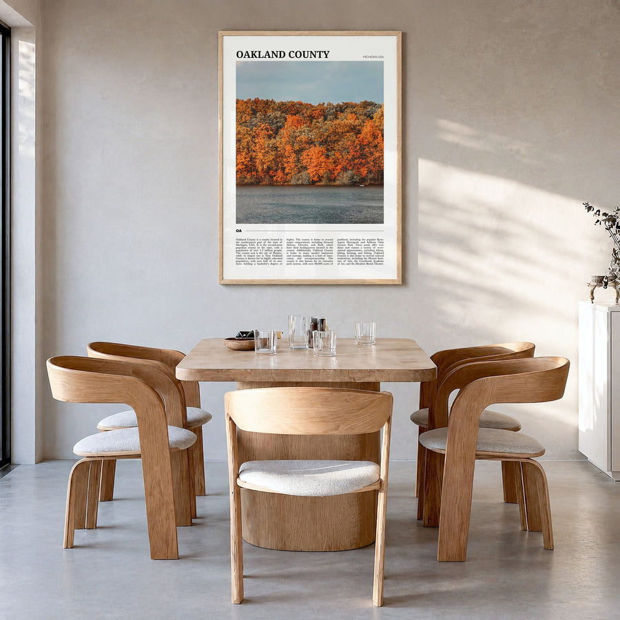 Oakland County Travel Poster in a natural wood frame, hanging in a dining room