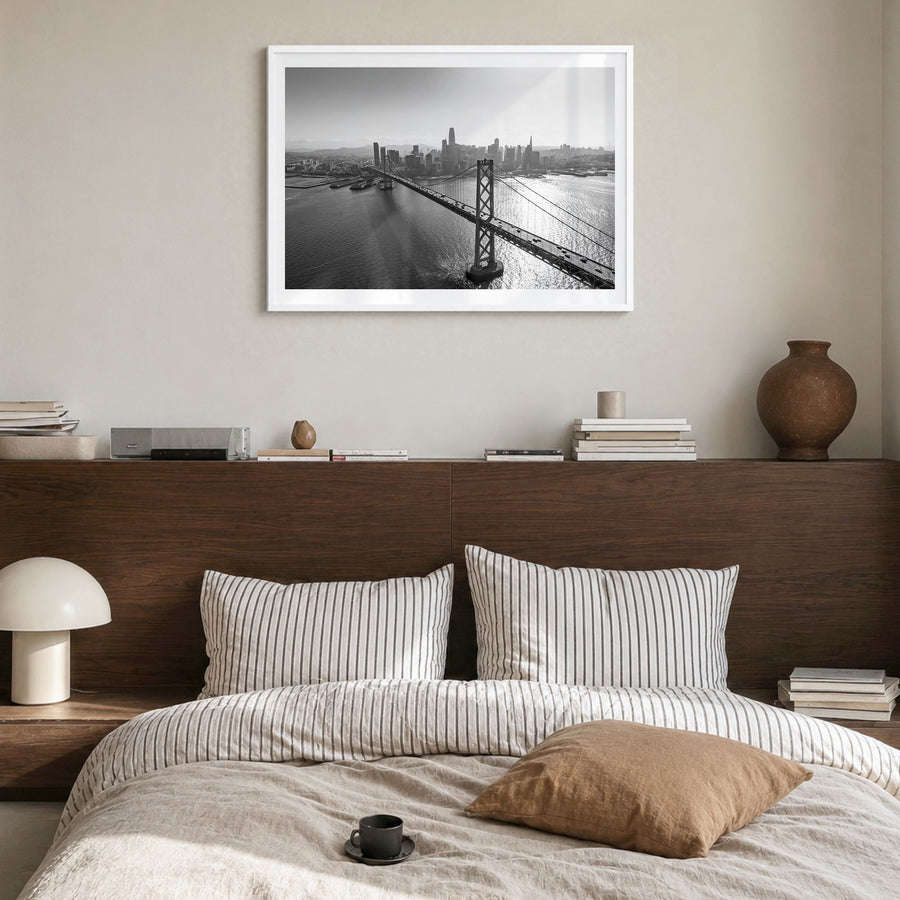 Oakland Photo Poster in a white wood frame, hanging in a bedroom, white border