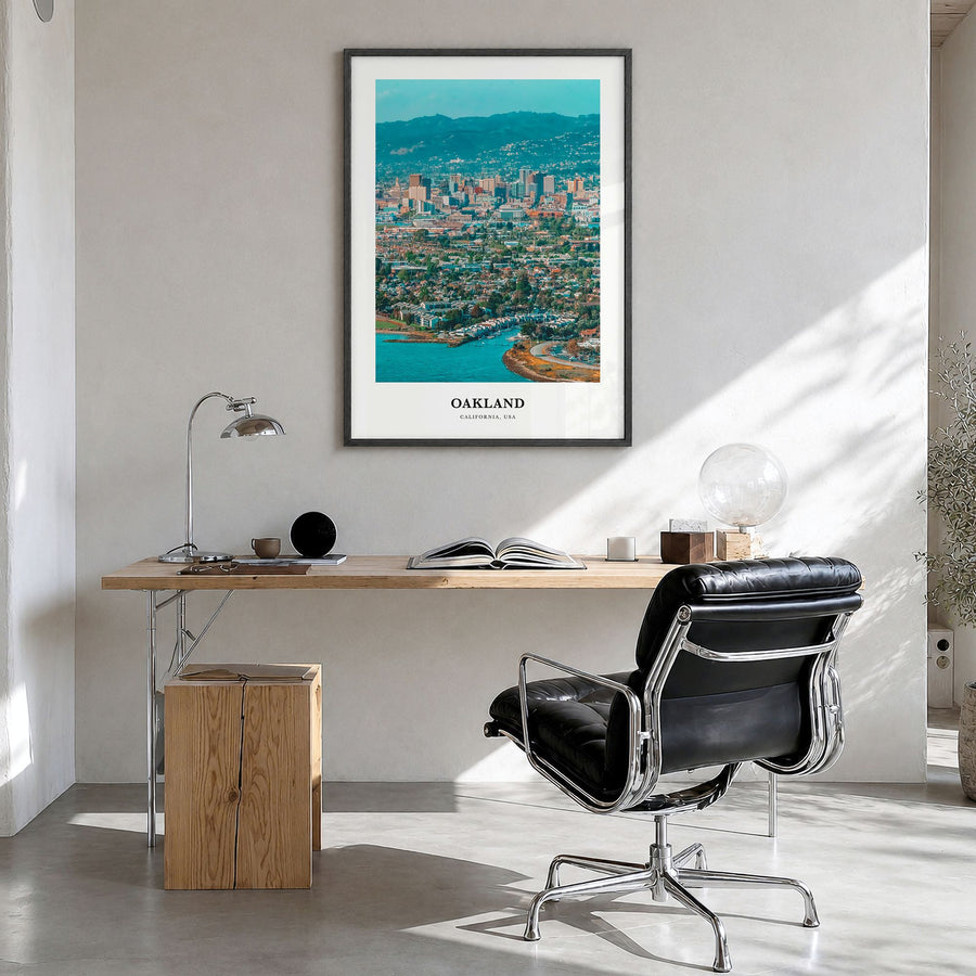 Oakland Classic Poster in a black wood frame, hanging in a bright home office
