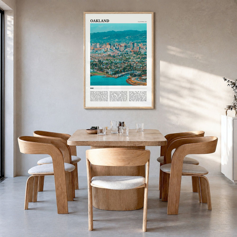 Oakland Travel Poster in a natural wood frame, hanging in a dining room