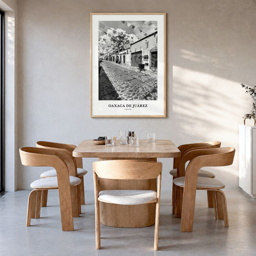 Oaxaca de Juárez Classic Poster in a natural wood frame, hanging in a dining room