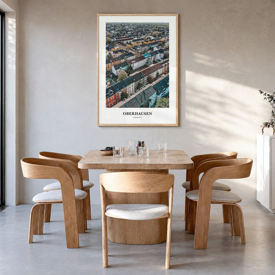 Oberhausen Classic Poster in a natural wood frame, hanging in a dining room