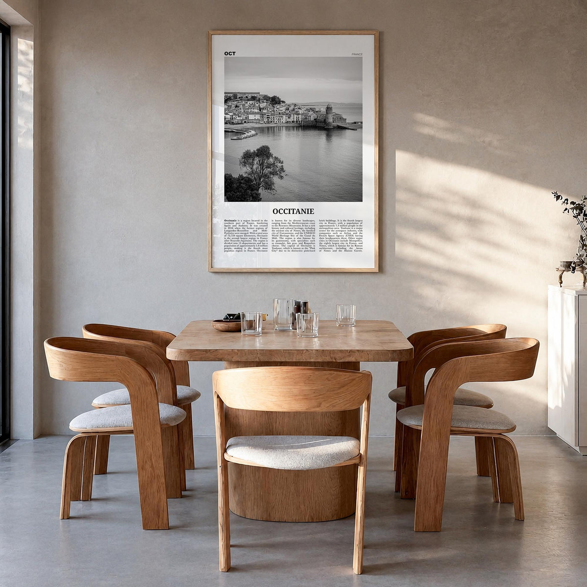 Occitanie black & white newspaper poster of France – vertical wall art in natural wood frame, hanging on wall