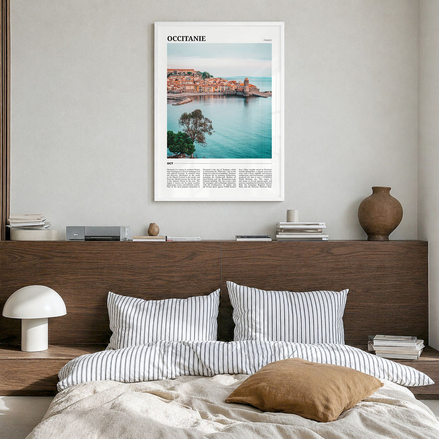Occitanie Travel Poster in a white wood frame, hanging in a bedroom