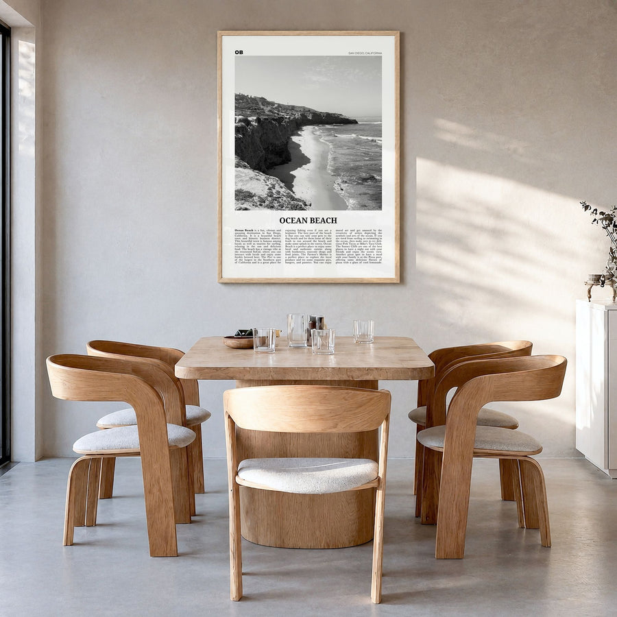 Ocean Beach Newspaper Poster in a natural wood frame, hanging in a dining room
