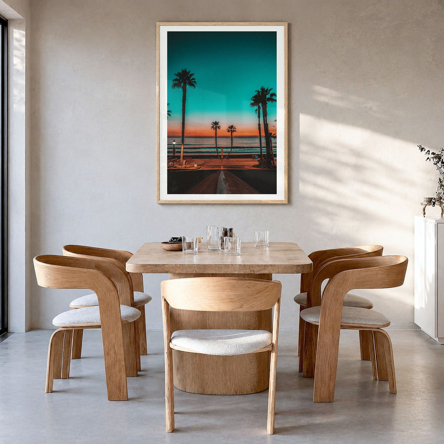 Oceanside Photo No 1 Poster in a natural wood frame, hanging in a dining room, white border