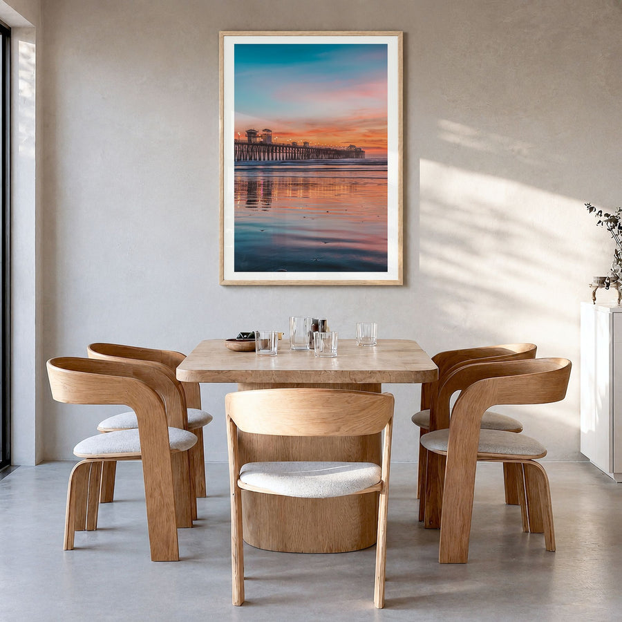 Oceanside Photo No 4 Poster in a natural wood frame, hanging in a dining room, white border