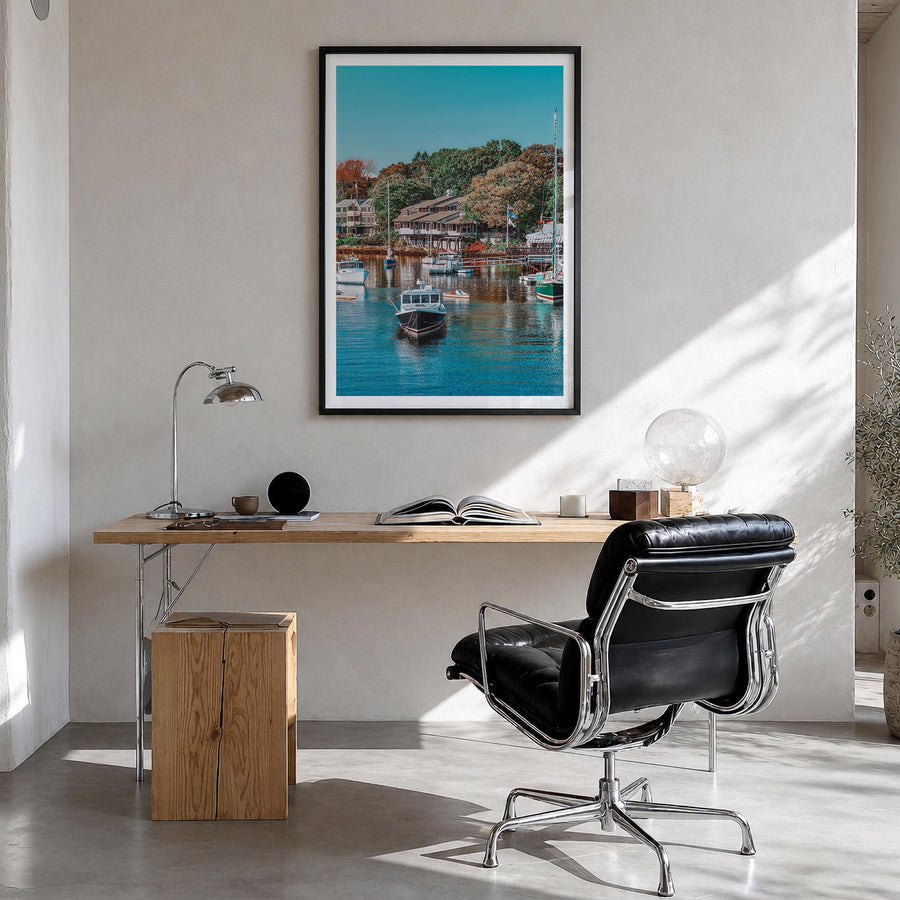 Ogunquit colorful photo poster of Maine, USA – vertical wall art in black wood frame with white border, hanging on wall