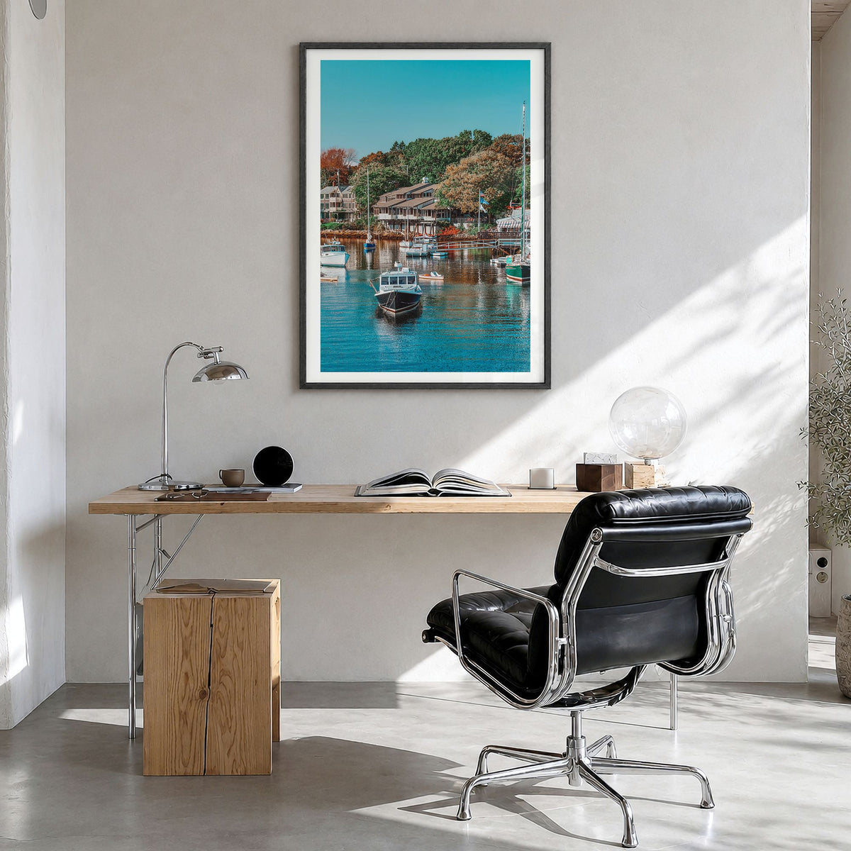 Ogunquit Photo Poster in a black wood frame, hanging in a bright home office, white border