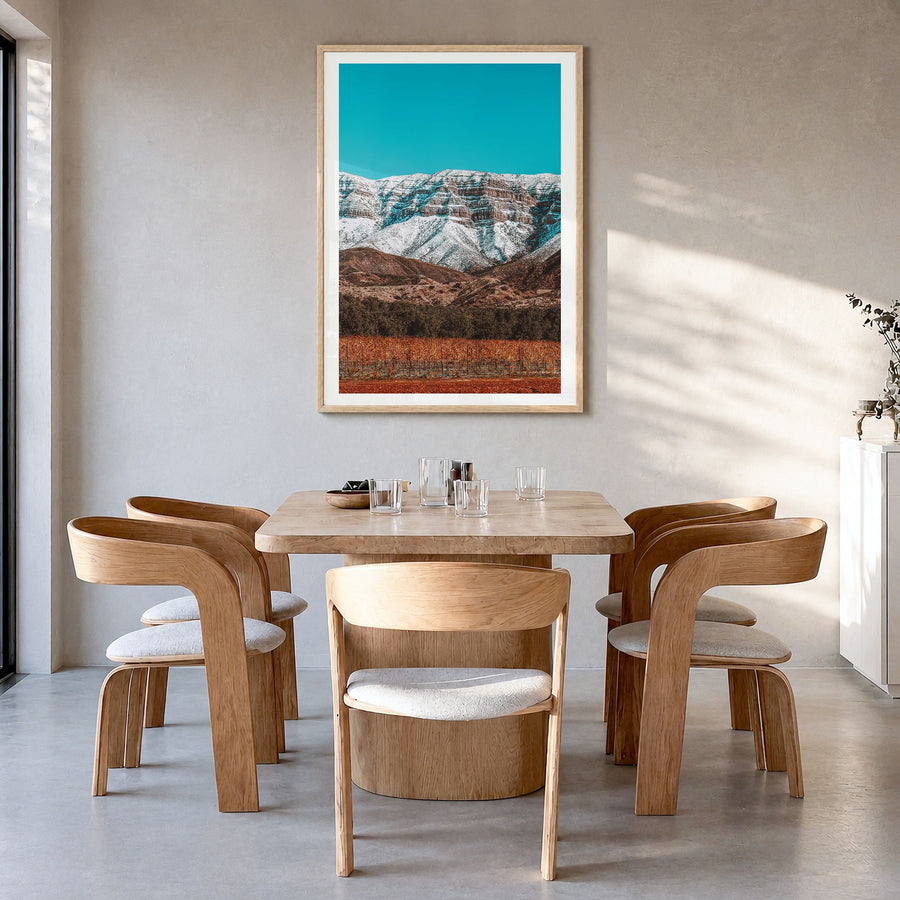 Ojai Photo Poster in a natural wood frame, hanging in a dining room, white border