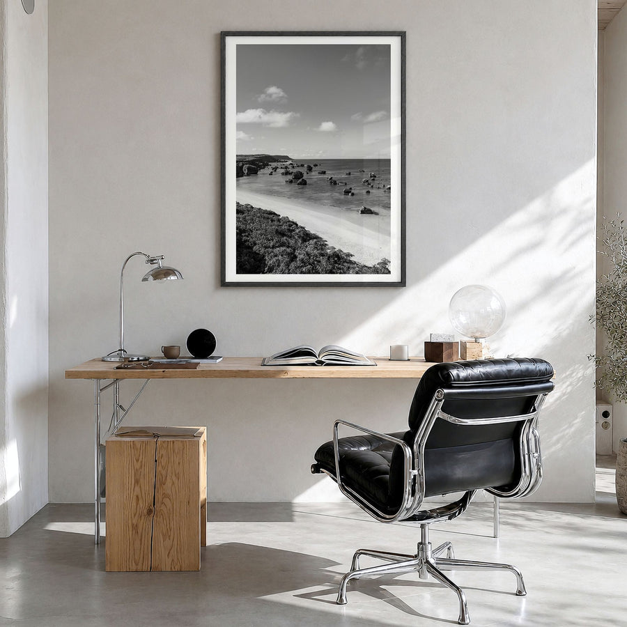 Okinawa Photo Poster in a black wood frame, hanging in a bright home office, white border