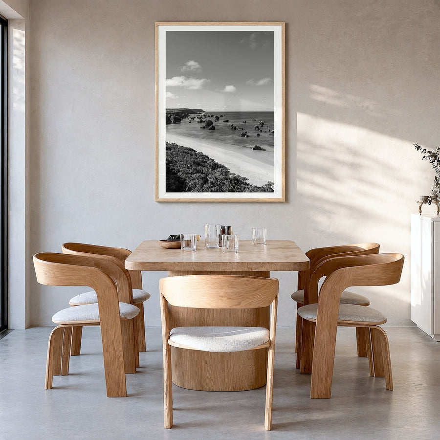 Okinawa Photo Poster in a natural wood frame, hanging in a dining room, white border