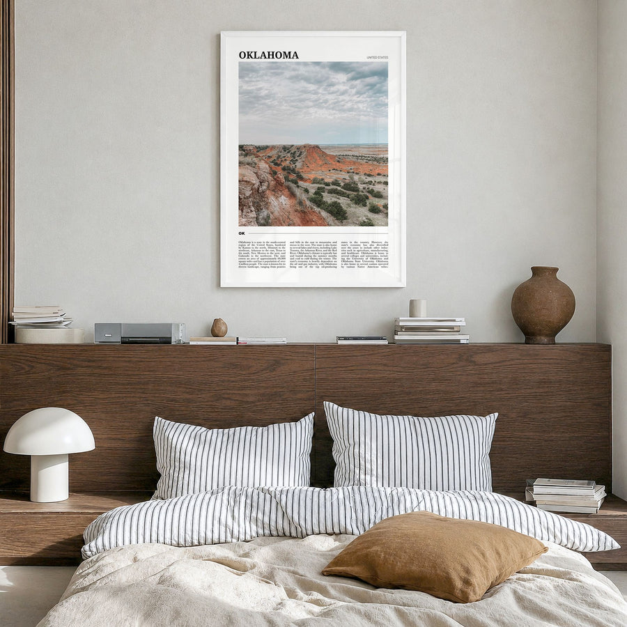 Oklahoma Travel Poster in a white wood frame, hanging in a bedroom