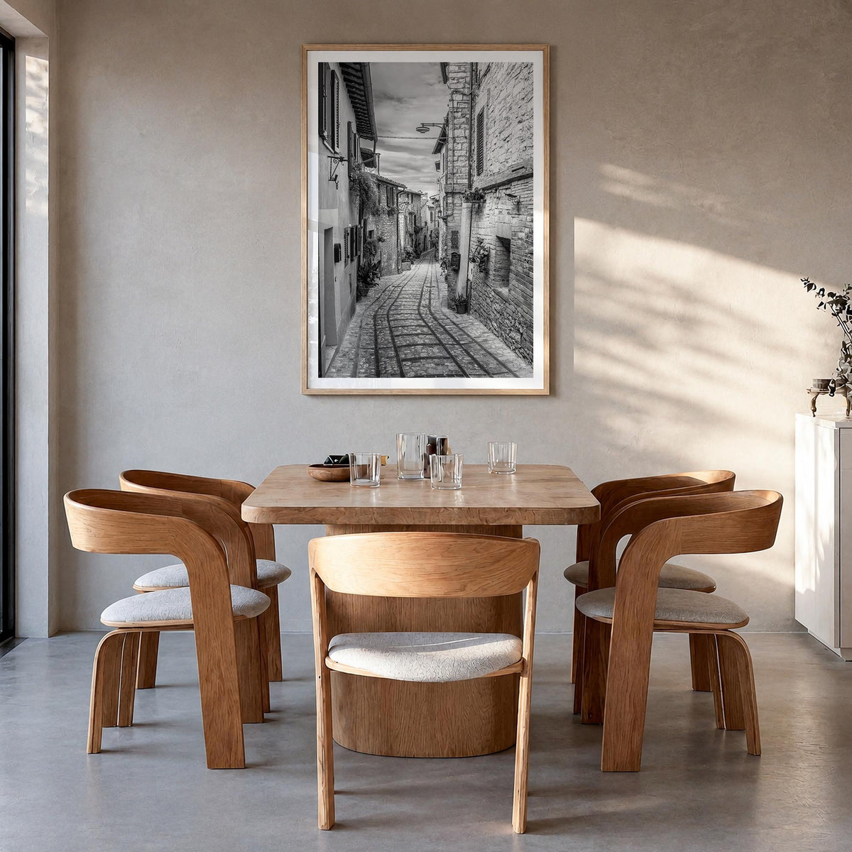 Old Town in Italy black & white photo poster – vertical wall art in natural wood frame with white border, hanging on wall