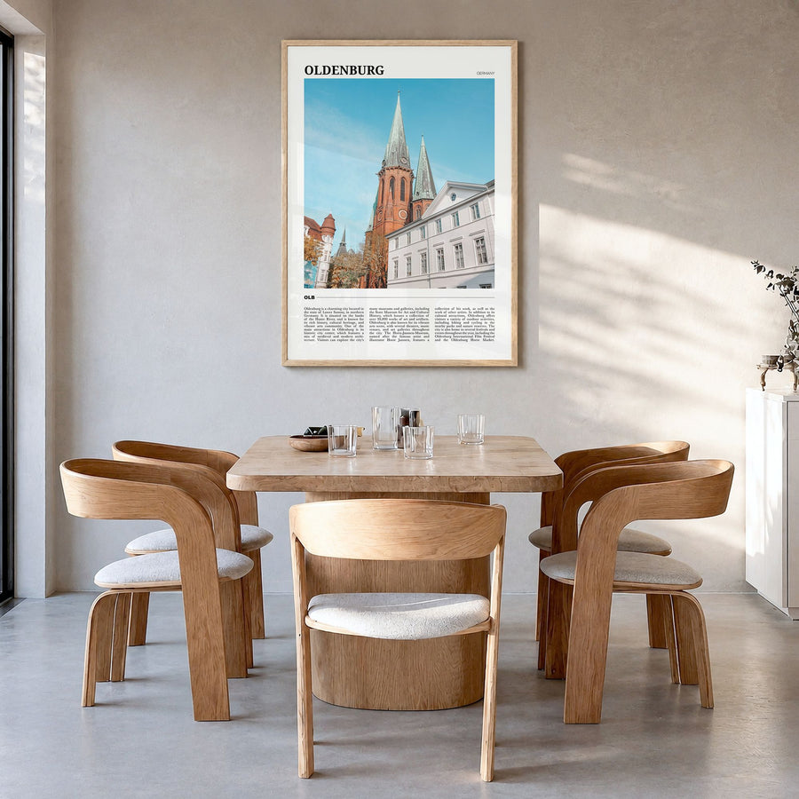 Oldenburg Travel Poster in a natural wood frame, hanging in a dining room