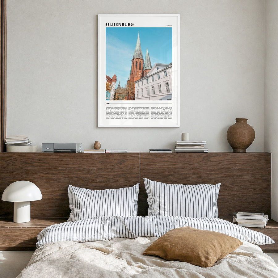 Oldenburg Travel Poster in a white wood frame, hanging in a bedroom