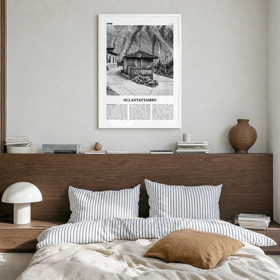 Ollantaytambo Newspaper Poster in a white wood frame, hanging in a bedroom
