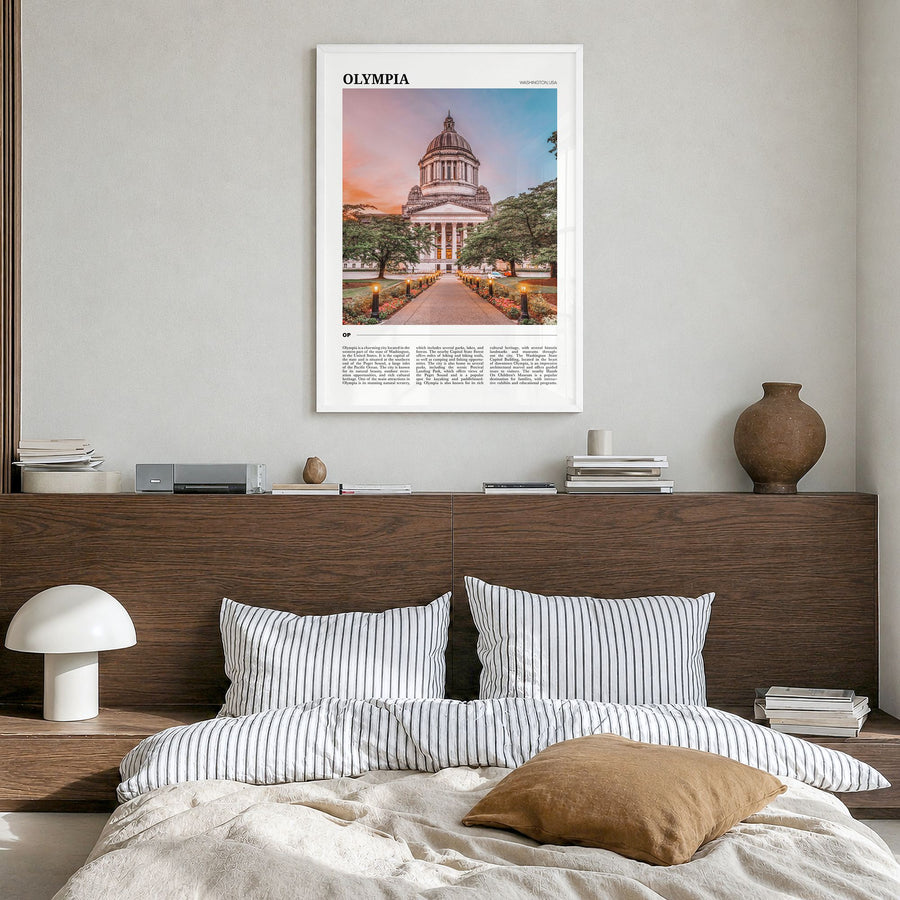 Olympia Travel Poster in a white wood frame, hanging in a bedroom