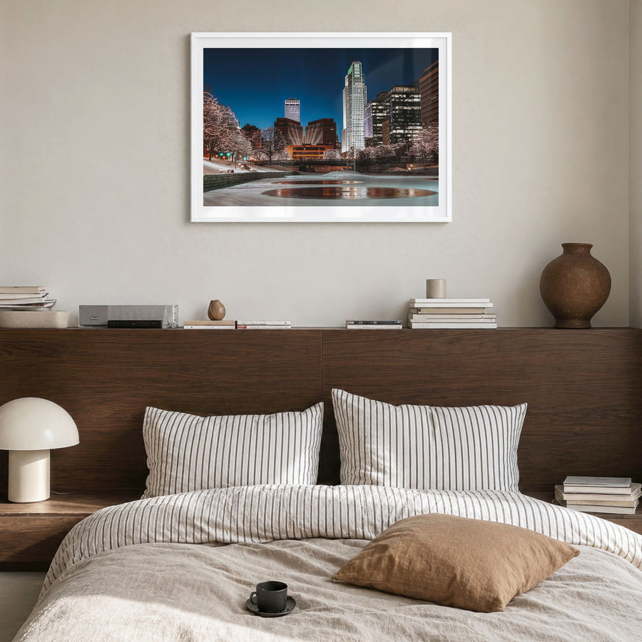 Omaha Photo Poster in a white wood frame, hanging in a bedroom, white border