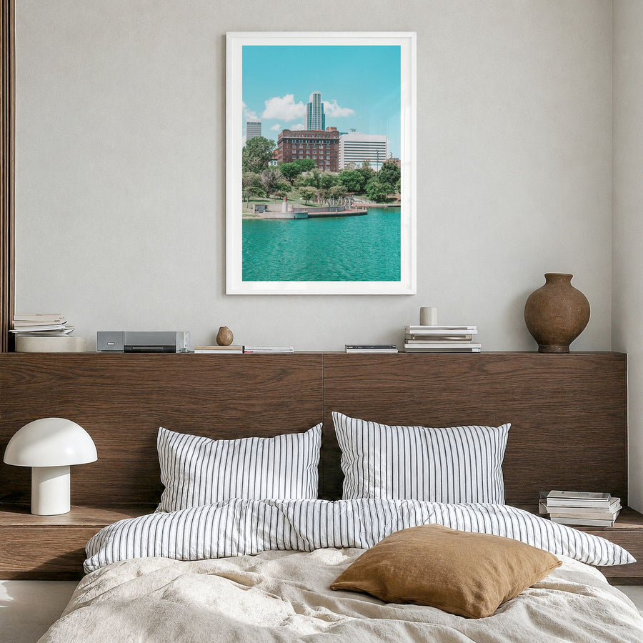 Omaha Photo Poster in a white wood frame, hanging in a bedroom, white border
