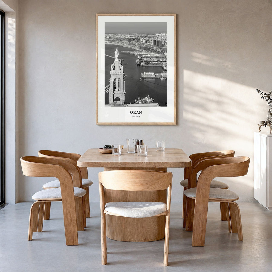 Oran Classic Poster in a natural wood frame, hanging in a dining room