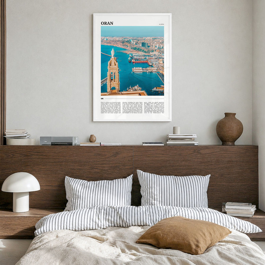 Oran Travel Poster in a white wood frame, hanging in a bedroom