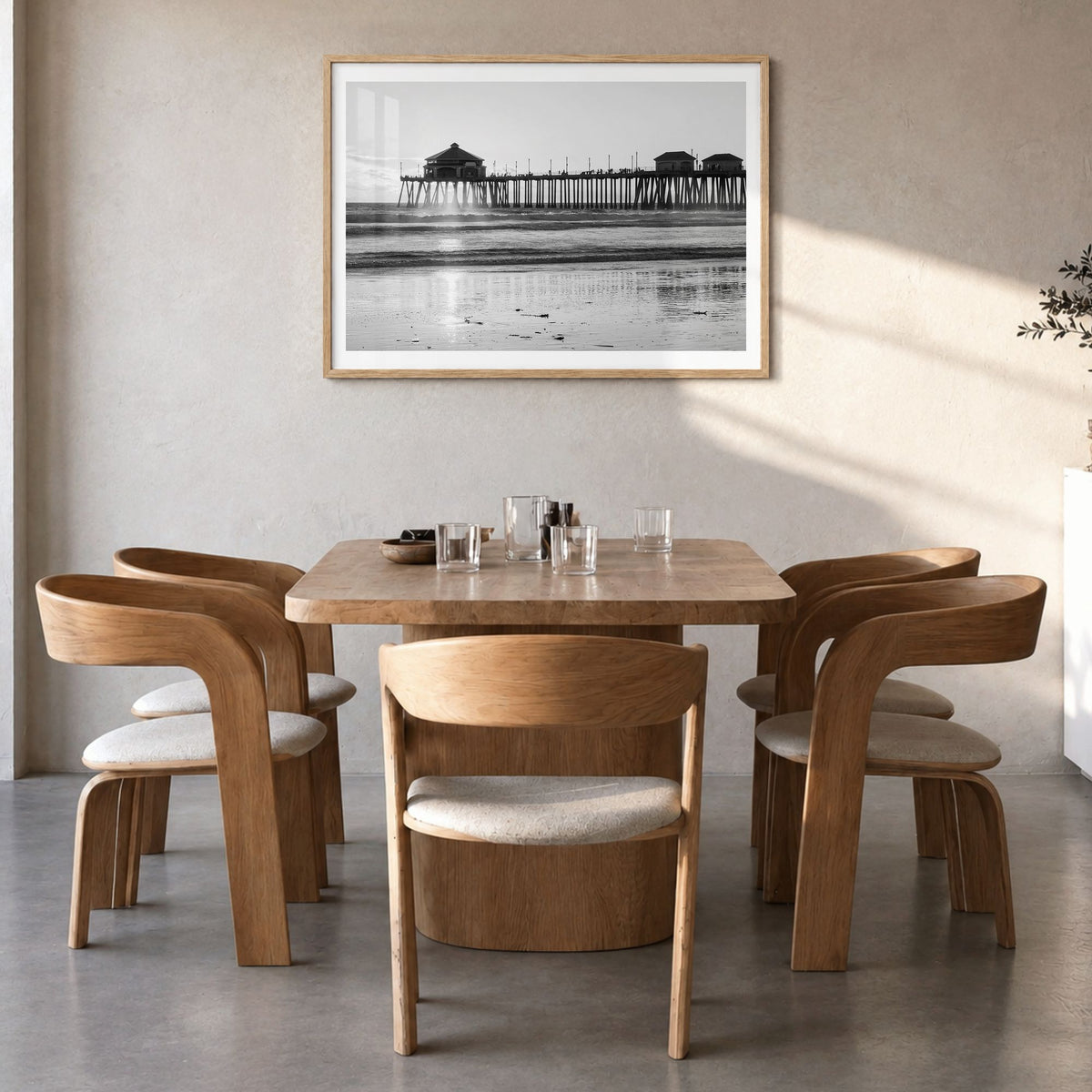 Orange County Photo Poster in a natural wood frame, hanging in a dining room, white border