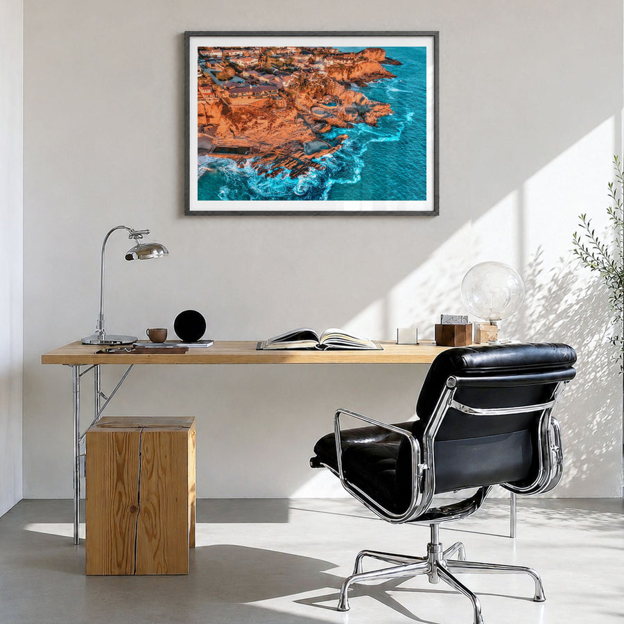 Orange County Photo Poster in a black wood frame, hanging in a bright home office, white border