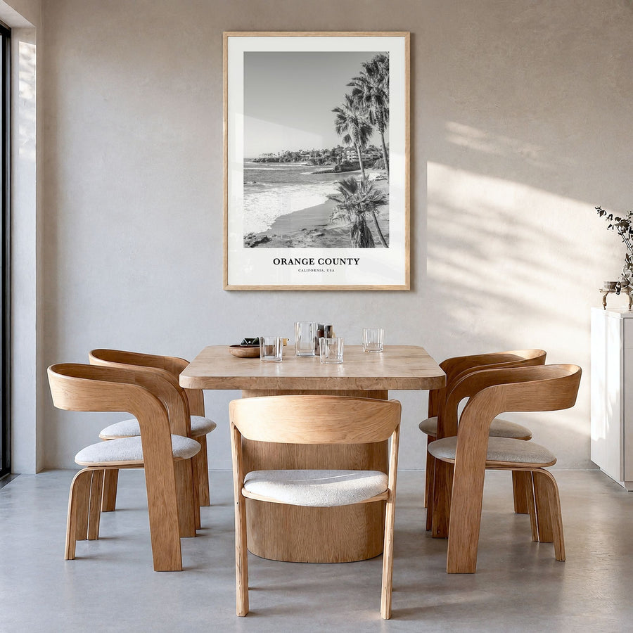 Orange County Classic Poster in a natural wood frame, hanging in a dining room