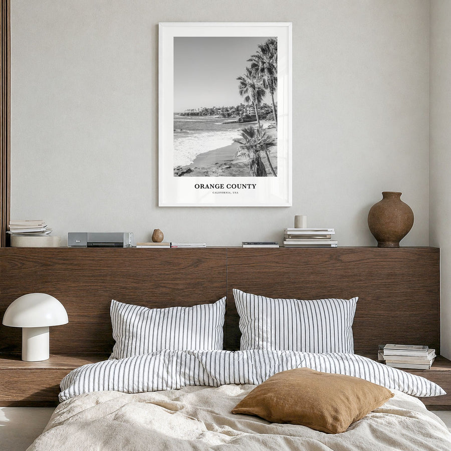 Orange County Classic Poster in a white wood frame, hanging in a bedroom