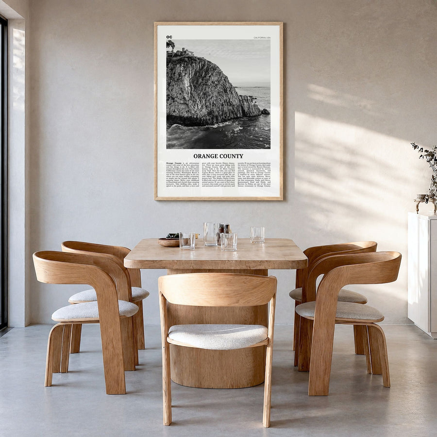 Orange County Newspaper No 2 Poster in a natural wood frame, hanging in a dining room