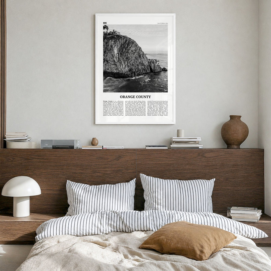 Orange County Newspaper No 2 Poster in a white wood frame, hanging in a bedroom