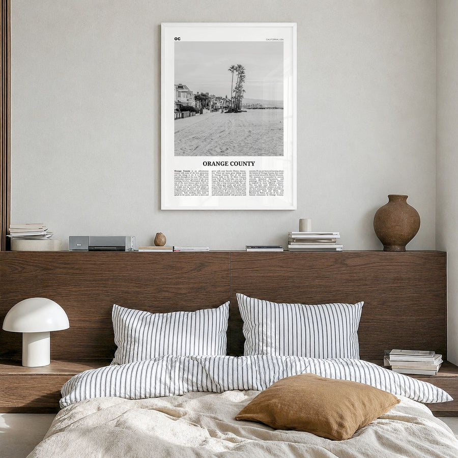 Orange County Newspaper No 4 Poster in a white wood frame, hanging in a bedroom