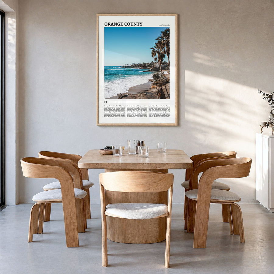 Orange County Travel Poster in a natural wood frame, hanging in a dining room